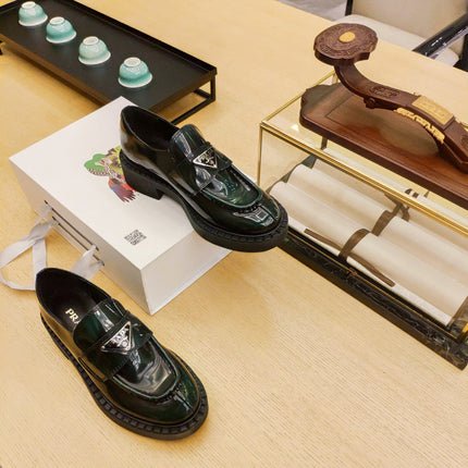 PRADA 26S PENNY LOAFERS 55MM IN GREEN PATENT CALFSKIN