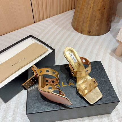 ALAIA TWO-STRAPS HIGH HEEL SANDALS IN GOLDEN PATENT LAMBSKIN