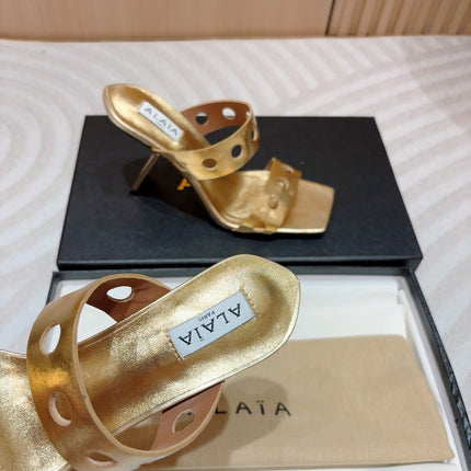 ALAIA TWO-STRAPS HIGH HEEL SANDALS IN GOLDEN PATENT LAMBSKIN