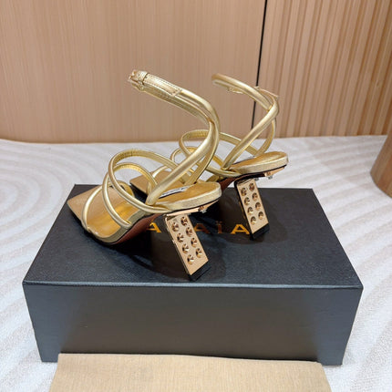 ALAIA THREE-STRAPS HIGH HEEL SANDALS IN GOLDEN PATENT LAMBSKIN