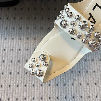 ALAIA FOLDED FLAT MULES WITH SPHERES ON WHITE CALFSKIN
