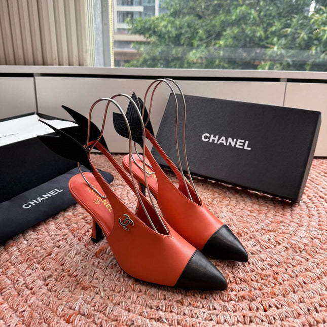 CHANEL 26S POINTED TOE HIGH HEEL SLINGBACKS IN ORANGE LAMBSKIN WITH BLACK FLORAL APPLIQUE