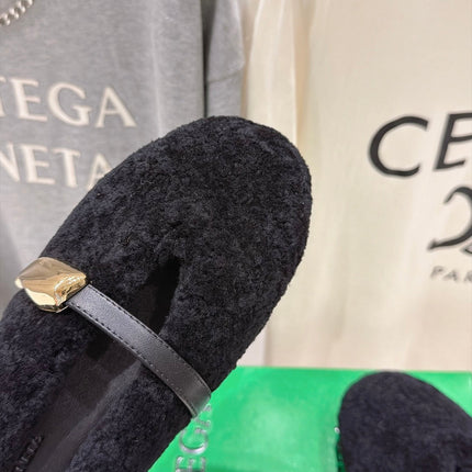 BOTTEGA VENETA 26S MULES IN BLACK SHEARLING WITH LEATHER STRAP