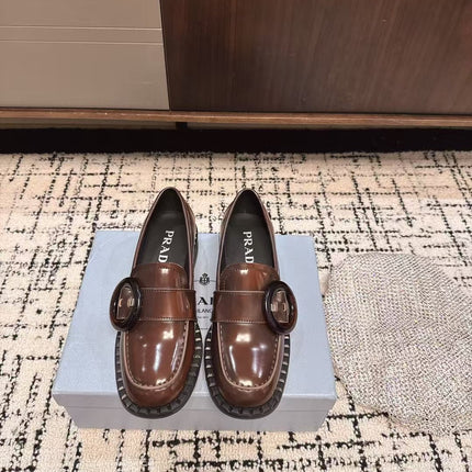 PRADA 26S BUCKLED LOAFERS IN DARK BROWN SHINY CALFSKIN