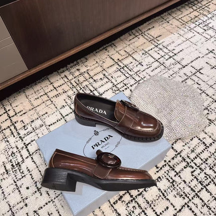 PRADA 26S BUCKLED LOAFERS IN DARK BROWN SHINY CALFSKIN