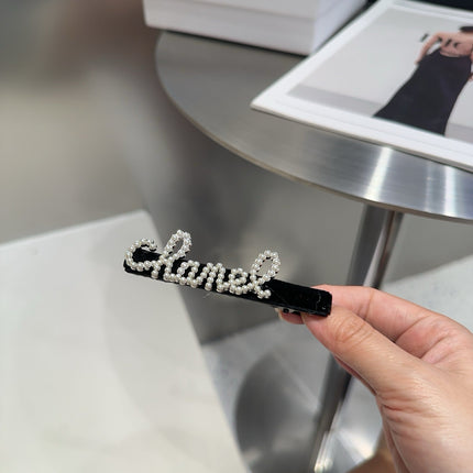 CHANEL 26S BOW HAIR CLIP IN BLACK RHINESTONE SCRIPT 505309