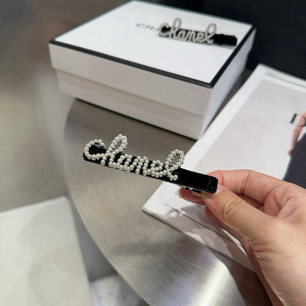 CHANEL 26S BOW HAIR CLIP IN BLACK RHINESTONE SCRIPT 505309