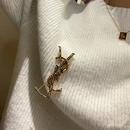 YSL 26S BAMBOO TEXTURED MONOGRAM BROOCH IN GOLD TONE METAL