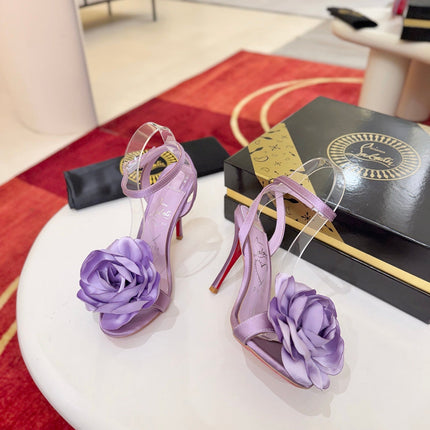 CHRISTIAN LOUBOUTIN 26S FLOWER-EMBELLISHED SANDALS 100 MM IN PURPLE SATIN