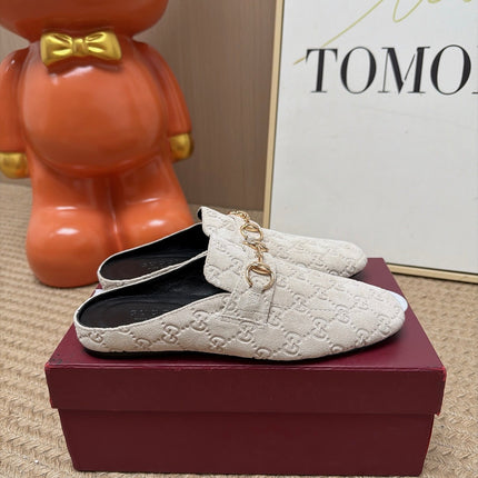GUCCI 26S FLAT MULES IN OFF WHITE GG EMBOSSED SUEDE