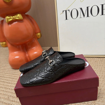 GUCCI 26S FLAT MULES IN BLACK GG EMBOSSED LAMBSKIN