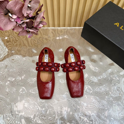 ALAIA MARY JANE PEARL IN GLOSSY MARS RED LAMBSKIN