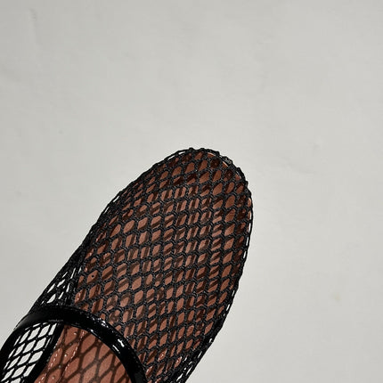 ALAIA FLAT MULES IN BLACK MESH FISHNET