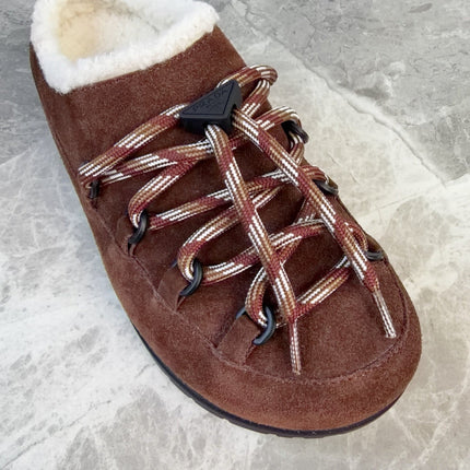PRADA 26S WOVEN MULES IN DARK BROWN SUEDE