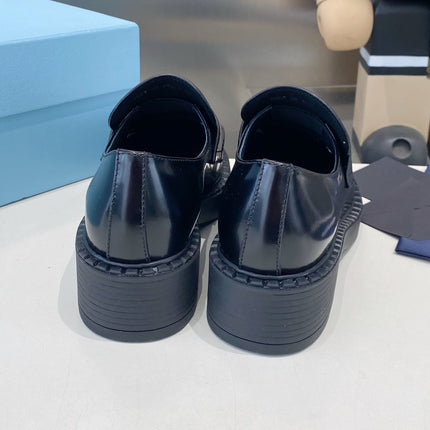 PRADA 26S LOAFERS IN BLACK AND WHITE CALFSKIN WITH LOGO
