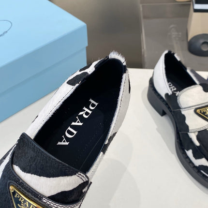 PRADA 26S LOAFERS IN WHITE AND BLACK COW PRINT PONY HAIR