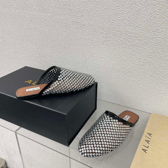 ALAIA FLAT MULES IN STRASS BLACK LAMBSKIN WITH RHINSTONES