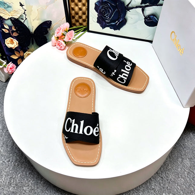 CHLOE 26S CRISSCROSS SLIDES IN BLACK CANVAS