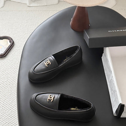 CHANEL 26S LOAFERS IN BLACK CALFSKIN AND SHEARLING LINING