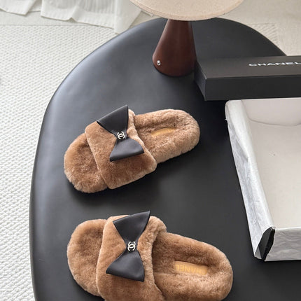 CHANEL 26S SLIDE SANDALS IN BROWN SHEARLING WITH BLACK BOW