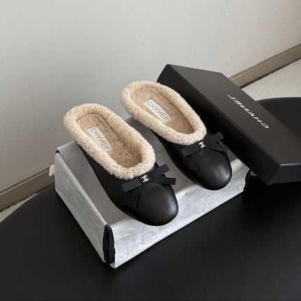 CHANEL 26S MULES IN BLACK LAMBSKIN AND SHEARLING