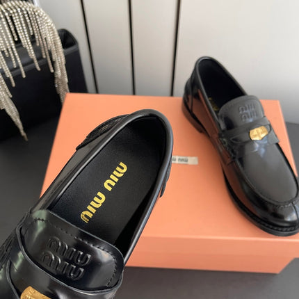 MIUMIU 26S PENNY LOAFERS IN BLACK GLOSSY CALFSKIN GOLD HARDWARE