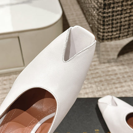 ALAIA SPIKE JEWEL MULES IN WHITE CALFSKIN