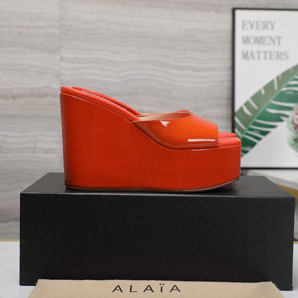 ALAIA PLATFORM WEDGE IN VIVID ORANGE LAMBSKIN WITH RED HEART